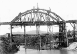 The Victoria Battery low level water race downstream water race flume bridge crossing the Ohinemuri River under construction.